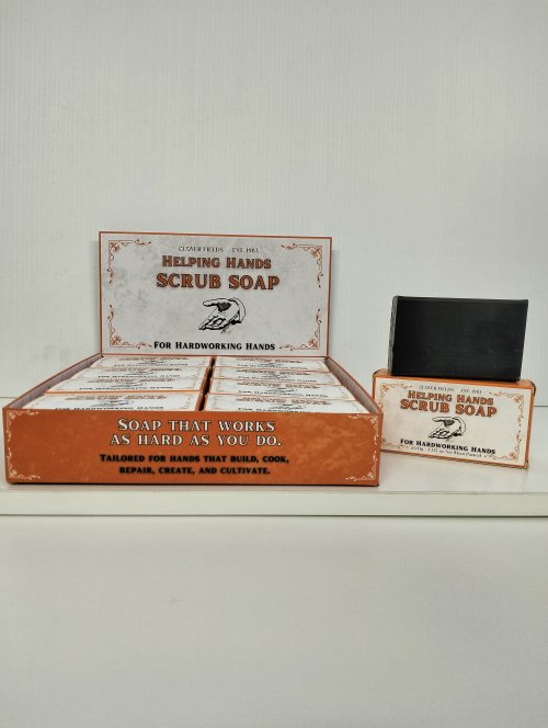 HELPING HANDS SCRUB SOAP - Introducing our hardworking scrub soap, meticulously tailored for hands that build, cook, create, and cultivate. Crafted with potent ingredients like pumice and activated charcoal, this soap ensures a thorough cleanse, tackling tough dirt and grime with ease. Despite its powerful cleaning properties, its gentle formula ensures its kind to your skin, leaving your hands feeling nourished and refreshed. Experience the difference with our compact yet mighty soap that works as hard as you do.

200g Helping Hands Scrub Soap for hardworking hands. Quality natural handmade soaps, candle, home, bathroom & beauty products make great gift ideas for him & her for any occasion or if you just want to treat yourself.